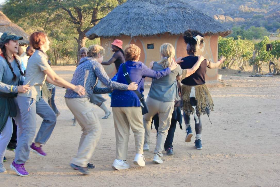 Guests and family dancing in a circle