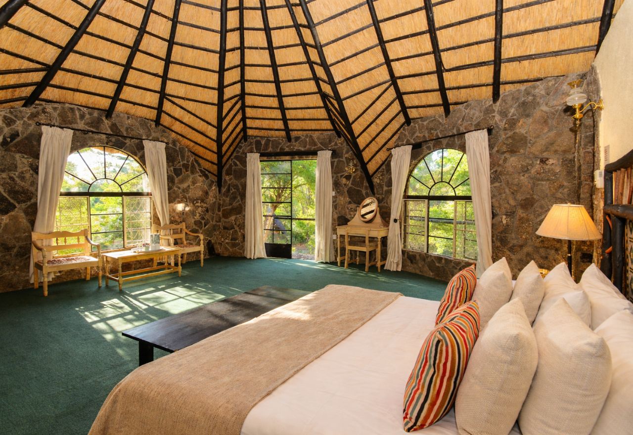 Double chalet with a double bed at Matobo Hills Lodge