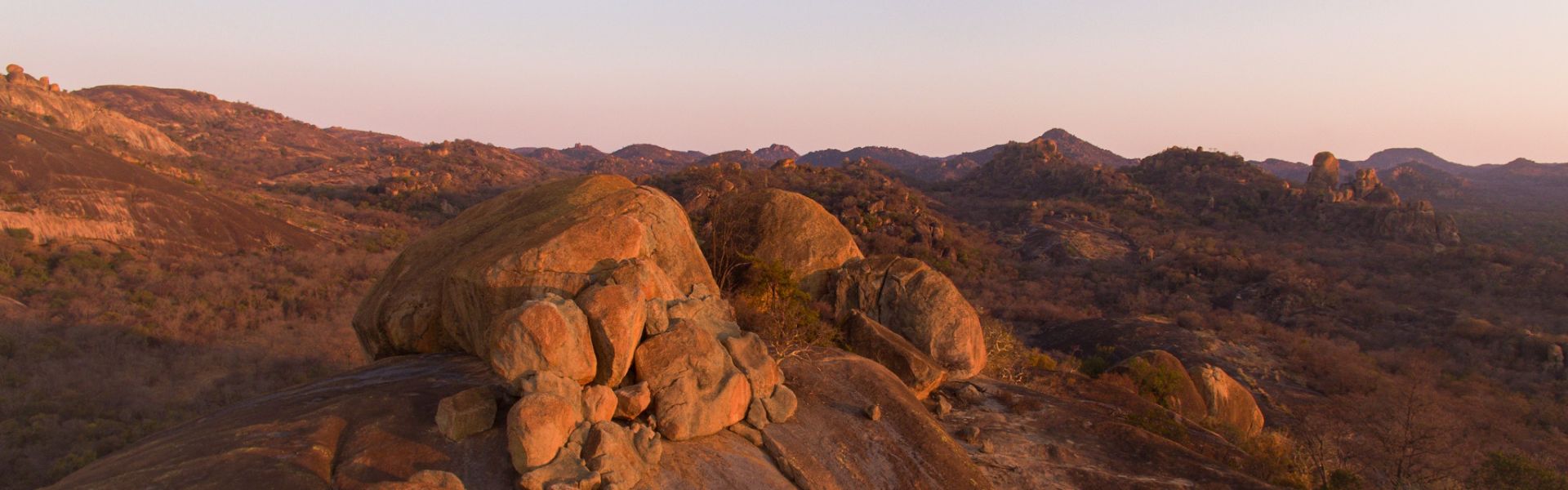 Tall granite rock formation during the hot build-up to rain