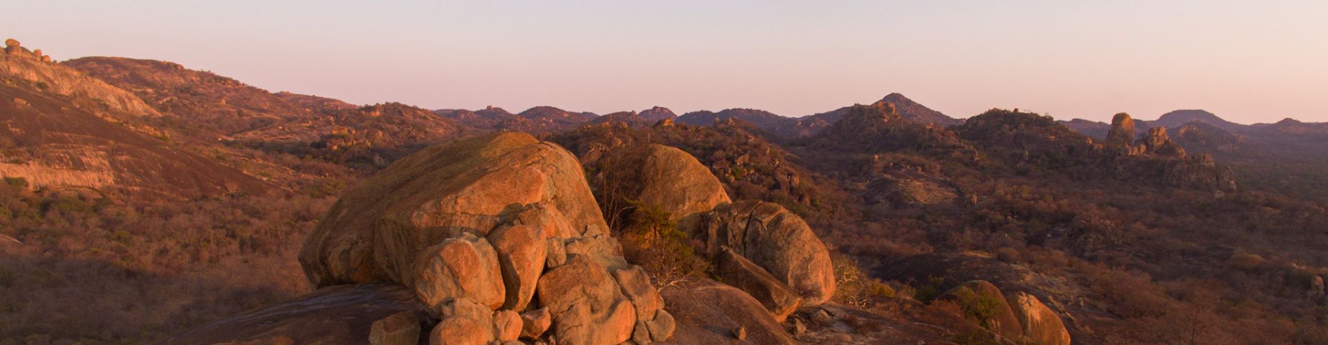Dry-season golden grass and granite kopjes in Matobo Hills