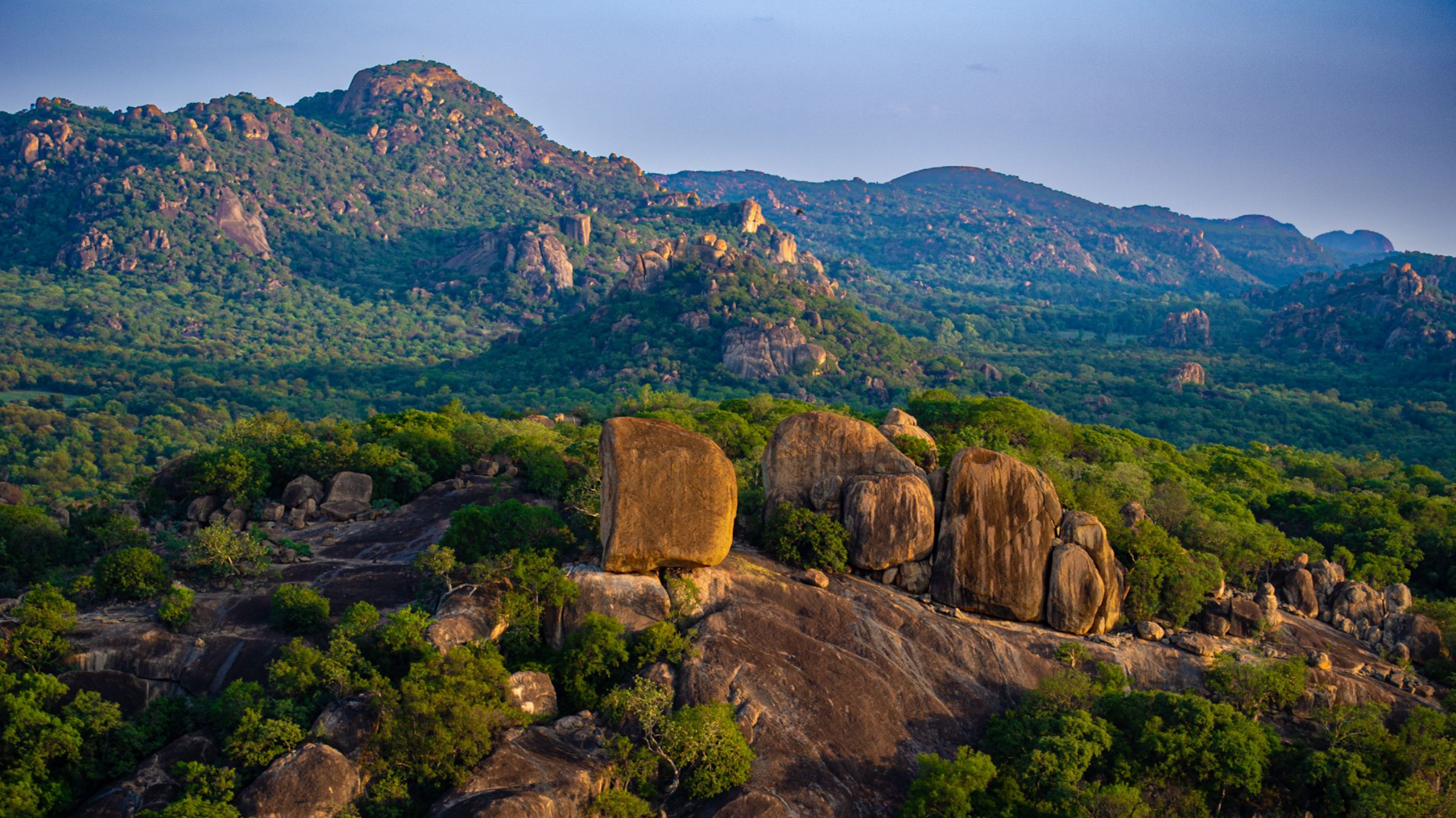 Golden hour panorama of granite kopjes in Matobo