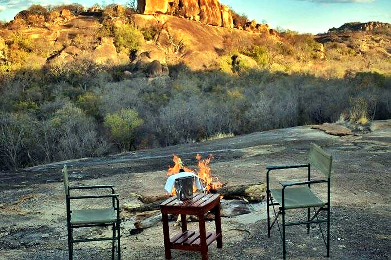 Hilltop braai setup on granite rocks at Matobo Hills Lodge.