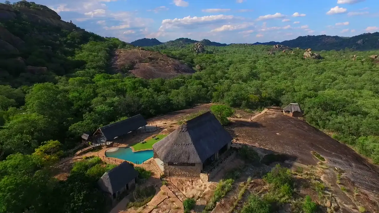 Aerial view of Matobo Hills Lodge and its pool set among granite kopjes